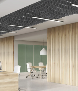 Hatch work acoustic panels in a wave formation are suspended in a modern looking work space.